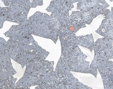 Pavers in a public space featuring a stylised flock of birds