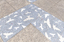 Pavers in a public space featuring a stylised flock of birds