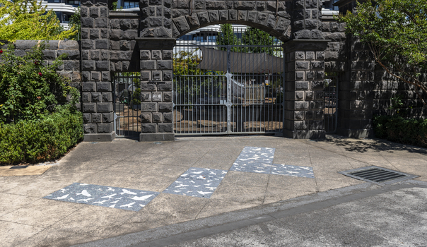 Pavers in a public space featuring a stylised flock of birds