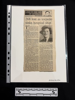 Newspaper clipping with column title, drawing of column author, article title, two columns of text and a photo embedded in one of the text columns.