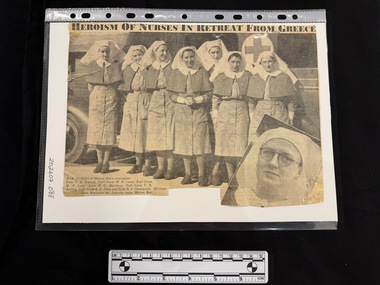 Newspaper clipping with large photograph of eight women in nurses uniforms and a photograph of another woman inset to the bottom right of the large photograph.  Also title of article and caption of large photograph present.