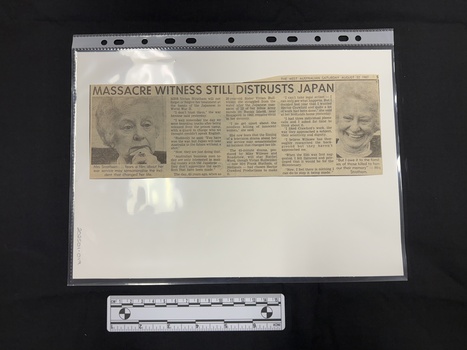 Newspaper clipping with two embedded close up head shots in black and white of the same woman.  One photograph shows her looking serious with her hand to her chin, in the other she is smiling.  There are three columns of text between the photographs.