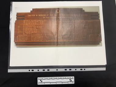 Print out of a colour photograph of an honour board made of wood with gilt lettering listing nurses who served in WWI