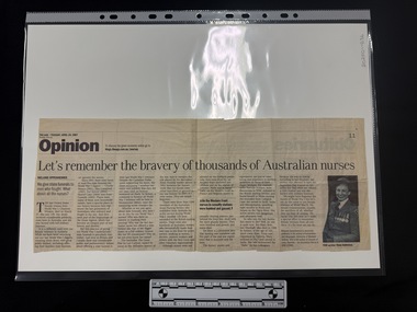 Newspaper clipping with a black and white photograph on the right of a smiling woman in military nurses uniform.  Article has seven columns of text.