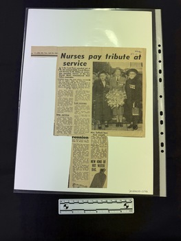 Newspaper clipping of articles on both sides, with some parts missing. One side has a black and white photograph of three woman wearing medals and holding a floral tribute.  The other side has a black and white photograph of two women in Army nursing uniforms looking at the camera.  There are a range of articles on both sides.