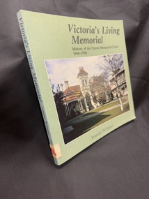 Image of a green book with title, author information and a photo of a building scene on the front cover