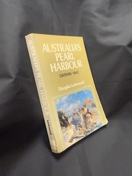 Paperback book with olive green cover and spine, cover also has a partial image of an artwork