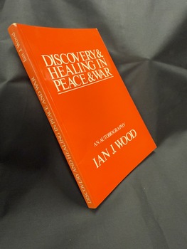 Red paperback book with white text on spine and cover, spine writing from bottom to top
