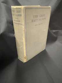 Grey hardback book with blue writing on cover and spine