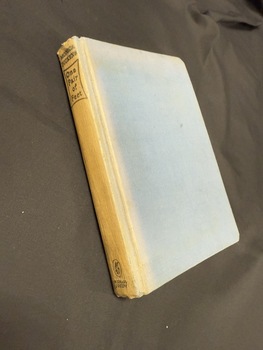 Book has no dustjacket, is bound with blue book cloth and has gold text on the spine