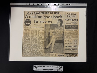 Article featuring three columns of text and one large black and white photograph of a woman in uniform seated on a chair.  The clipping also has two and a bit advertisements and another small article down the right hand side.