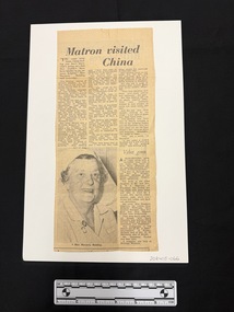 Clipping has main article with black and white photograph of an older woman in nurses uniform and three columns of text.  There is another small article at the end of the third column of the main article.