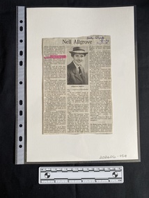 Newspaper clipping with three columns of text and a centered black and white photo of a woman in uniform