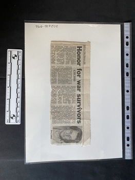 Newspaper clipping with four columns of text followed by a photo