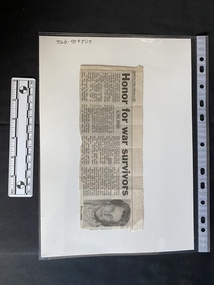 Newspaper clipping with four columns of text followed by a photo