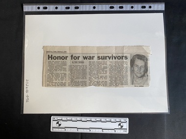 Newspaper clipping with four columns of text followed by a black and white photo of an older woman