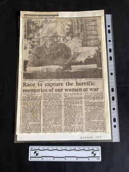Newspaper article of four columns of text under a large black and white photo of an older woman