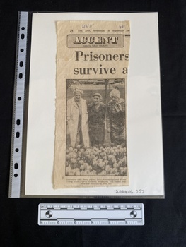 A newspaper clipping featuring a large photo of three older women with a caption beneath