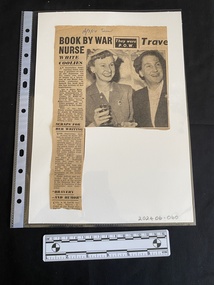 Newspaper clipping of a single column of text and large black and white photo of two women
