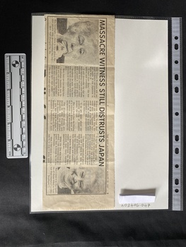 A newspaper clipping with two photos and three columns of text