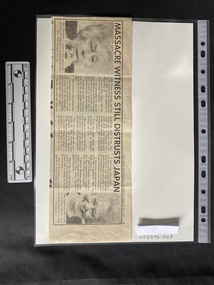 A newspaper clipping with two photos and three columns of text