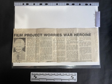 Newspaper clipping with a black and white photo of an older woman and four columns of text
