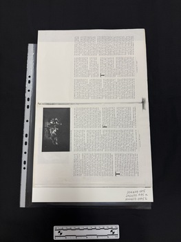 Photocopy of a double page spread of a journal article with a small black and white photograph of women that is difficult to make out, this spread has six columns of text.