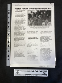 An article from a newsletter with three columns of text and a black and white photo of a group of people