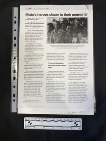 An article from a newsletter with three columns of text and a black and white photo of a group of people