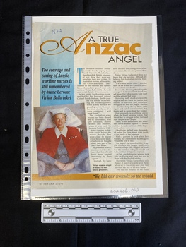 First page of a magazine clipping consisting of a large title with two columns of text next to a colour reproduction of a painting of a nurse