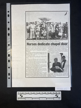A photocopied news paper clipping of an article with a large black and white photo of a group of women above two columns of text and a smaller black a white photo of two people