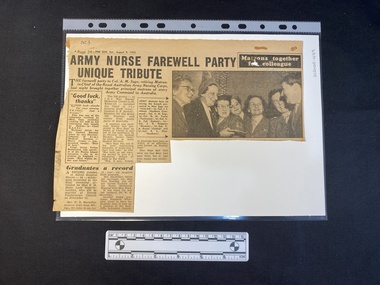 A newspaper clipping consisting of three columns of text next to a black and white photo of a group of women
