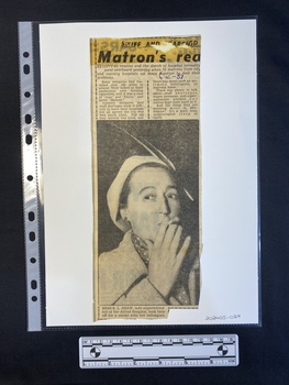 A newspaper clipping of a short story of two columns above a large black and white photo