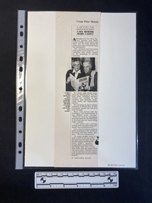 A photocopy of a magazine clipping of a single, long column of text that includes a small black and white photo