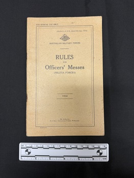 Tan brown staple bound booklet with black ink used for printing on the front cover