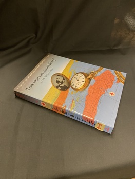 Paperback book with a bluish grey cover and a map of the world, predominantly showing Australia, on the front cover and spine. Main heading is in black text and subheading is in white text (cover) and red text (spine). There is an open gold pocket watch on the map with a black and white photo of a gentleman displayed inside.