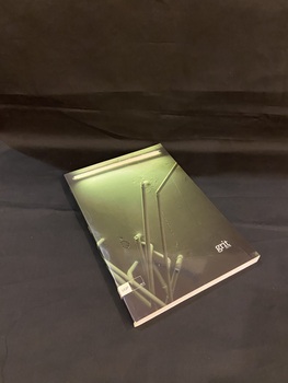 Dark green paperback book. On the spine reads JAS 78, grit, UQP. The front cover shows a darkly lit concrete wall with multiple water pipes coming out at different angles, there is a fluorescent strip light across the top. In the lower right corner of the cover in white print it reads 'grit JAS 78' in small text. There is a small white box on the lower left that reads UQP api.