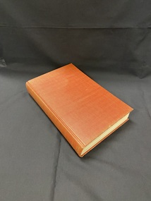 Dark red cloth bound hardcover book without a dust jacket. 