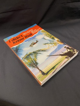 Large colourful paperback book with an image of two soldiers manning a weapon on a beach under palm trees, in the blue sky above is a Japanese military plane. There is a red panel across the top that has been made to look like a torn piece of paper with the title printed across it in black and white text.