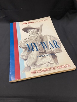 Large paperback book with a blue,red,light blue stripe running vertically down the left side, an image of a soldier covering most of the cover and the title and author in blue text across the middle.