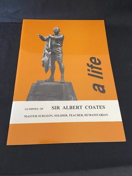 Orange coloured paperback book with an image of a statue of a man putting on a jacket, the base of the statue reds "Albert Coates'. In black lowercase letters on the right hand side, reading sideways, are the words 'a life'. In a panel across the lower part of the book in black text is the rest of the subheading.
