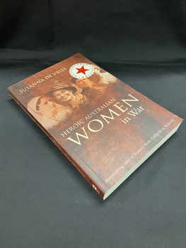 Brown cover with cream printed text. There is an image of four nurses in different uniforms across the top. There is also a white circle in the top right corner with a red star in the middle and 'autograhed edition' printed around the edge in red print.