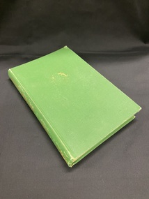 Green cloth bound book with a gold compass symbol on the front cover and gold printed heading and author on the spine.
