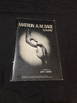 Stapled booklet with black cover. Title and authors name are printed in white on the front cover along with phograph of a sculpture of two hands reaching towards each other ['hands' by Henry Moore].
