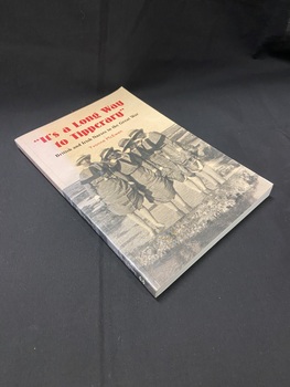 Peach coloured cover with a black and white image of four nurses wearing hats and holding the bottom of their dresses up while they stand ankle deep in the ocean. The title is printed above the image in red print with black subtitle. The author's name also appears in red text.