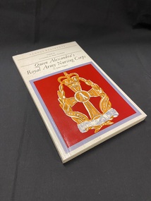 The spine and background of the cover are a cream colour. The title is printed in black text on the spine with the author's name. On the front cover, the lower part of the book displays a red square template with a mauve border, and inside the template is on orange emblem of the Queen Alexander's Royal Army Nursing Corps. Above this image, at the top of the page is the series title, the editor's name, main title and then in small writing, the author's name.