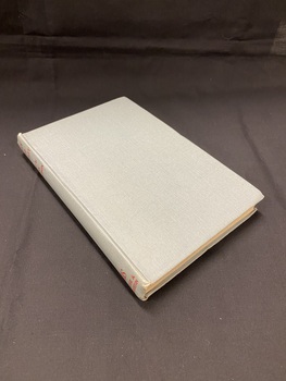 Light bluish-grey hardback book. The only markings on the book are along the spine where it reads 'GREY AND SCARLET / Edited by ADA HARRISON / Hodder & Stoughton' in red text.