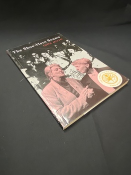 Thin black softcover book with a red-tinged photo of two women on the cover and in the background a black and white image of a group of women. The title is printed across the top and along the spine in white print. There is a 'NSW premier's literary award 1996 winner' sticker on the bottom right corner.