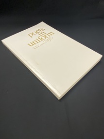 White paperback book with the title printed in gold print on the front cover and spine.