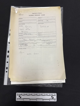 Document on thermal fax paper held together with a white archival paperclip.
